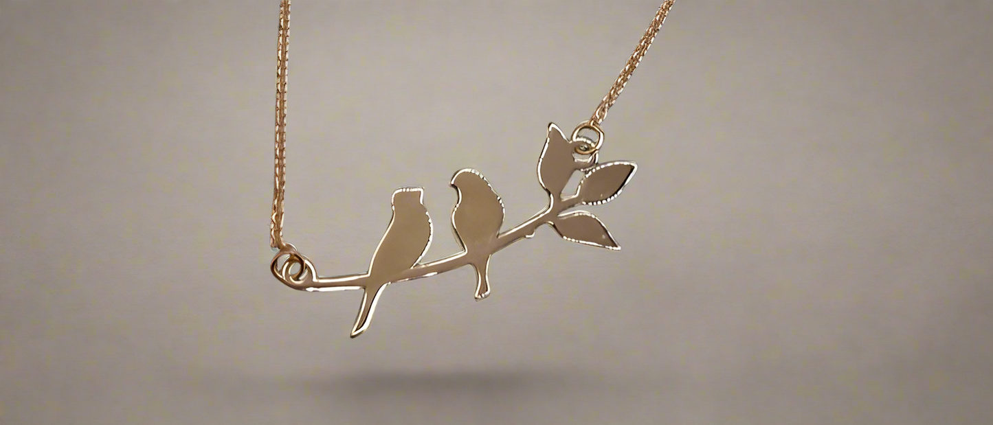 18K Two birds on a branch pendant